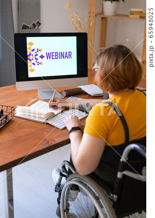 Watching webinar at home 65948025