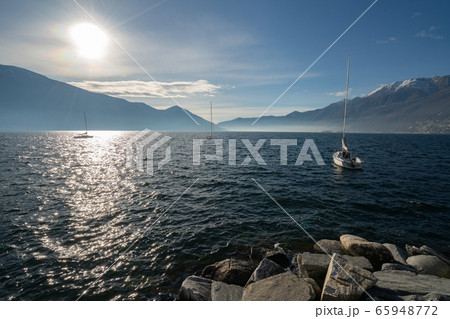 Winter view of lake Maggiore and surrounding alps 65948772