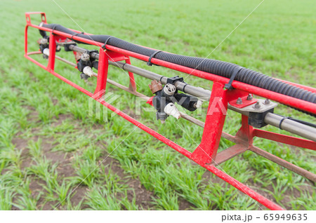 Close up liquid valve at sprayer boom Close up liquid valve at sprayer boom 65949635