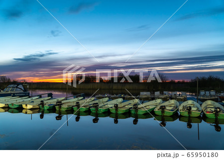 Russia. Leningrad region. Pleasure boats and boats at dawn in the Bayou of lake Ladoga near the city of Novaya Ladoga. 65950180