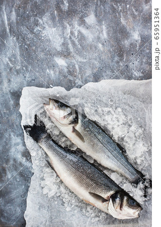 Raw fresh sea bream fish, top view, gray Raw fresh sea bream fish, top view, gray 65951364