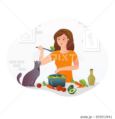 Girl cooks in the kitchen with a cat 65951941