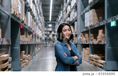Business woman at warehouse for export and import Business woman at warehouse for export and import 65956890