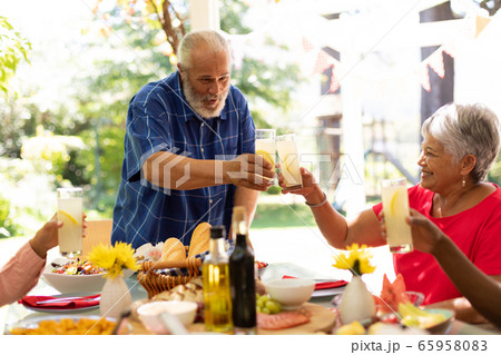 Family eating together at table 65958083