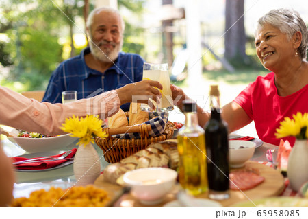 Family eating together at table Family eating together at table 65958085