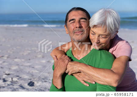 Senior Caucasian couple enjoying time at the beach Senior Caucasian couple enjoying time at the beach 65958171