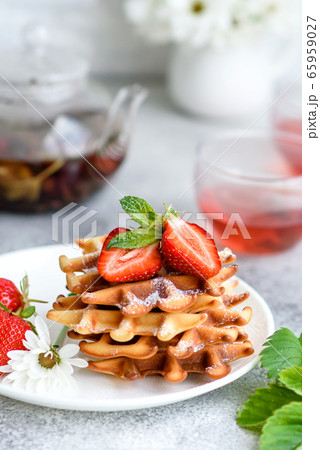 Delicious fresh baked belgian waffles with berries Delicious fresh baked belgian waffles with berries 65959027