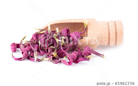 Dried Echinacea flowers on wooden spoon, isolated 65962256