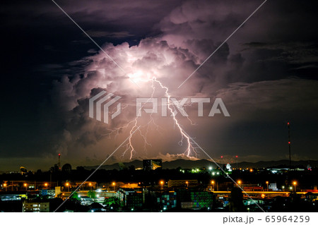 Cloudy with Bright lightning bolt strikes in the 65964259