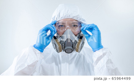 Scientist wearing biohazard chemical protective Scientist wearing biohazard chemical protective 65964499