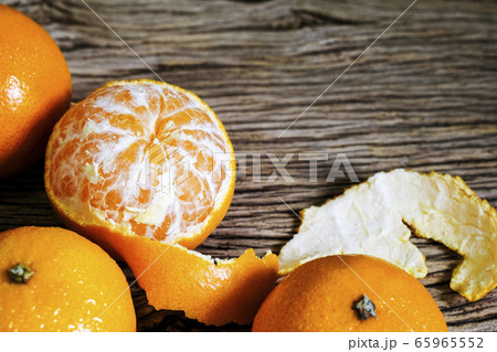 Mandarin orange on wood background with copy space Mandarin orange on wood background with copy space 65965552
