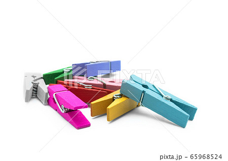 Colorful wooden clothespins isolated on the white background. Colorful wooden clothespins isolated on the white background. 65968524