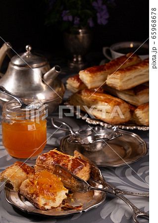 Puff pastry cookies in vintage utensils on a gray 65968678