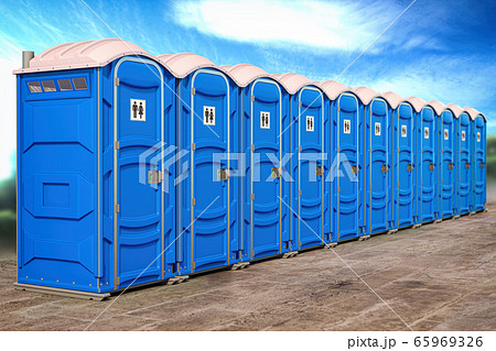 Portable plastic toilets in a row. 65969326