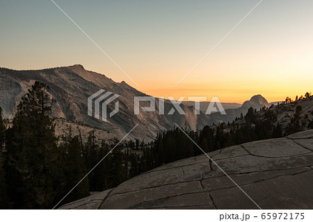 Sunset over the stone hills next to Olmsted Viewpoint in Yosemite National Park at sunset 65972175