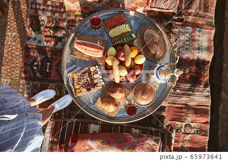 Taste it. Top view of traditional turkish hotel breakfast with fruits and vegetables in Cappadocia, Turkey Taste it. Top view of traditional turkish hotel breakfast with fruits and vegetables in Cappadocia, Turkey 65973641