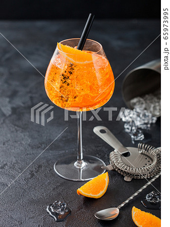 Glass of aperol spritz summer cocktail with orange 65973995