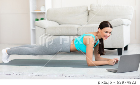 Sporty Woman At Laptop Doing Plank Exercise At Home, Panorama Sporty Woman At Laptop Doing Plank Exercise At Home, Panorama 65974822