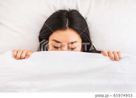 Korean Girl Sleeping Covered With Blanket In Bed Indoor, Top-View Korean Girl Sleeping Covered With Blanket In Bed Indoor, Top-View 65974953