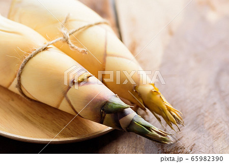 Raw bamboo shoot on wooden background, Organic vegetables 65982390