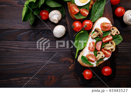 Bruschetta with tomatoes, ricotta and basil Bruschetta with tomatoes, ricotta and basil 65983527