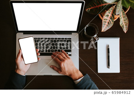 office workplace with manager using laptop and office workplace with manager using laptop and 65984912
