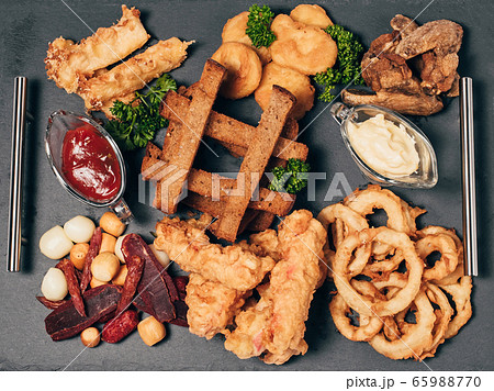 set of snacks for beer with breadcrumbs, sausage, cheese, sauces 65988770