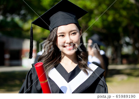 happy female graduate student happy female graduate student 65989190