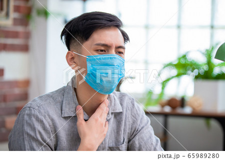 asian man has sore throat asian man has sore throat 65989280