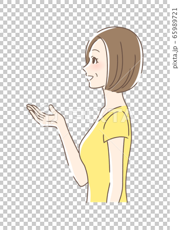Side profile of a woman smiling and holding out her hand Side profile of a woman smiling and holding out her hand 65989721