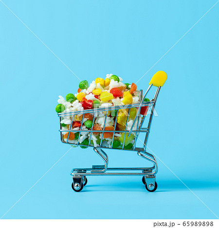 Frozen vegetables assorted on blue, top view Frozen vegetables assorted on blue, top view 65989898