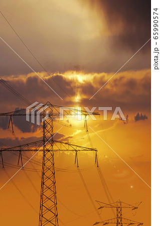 High voltage power lines. Electricity Pylons at Sunset High voltage power lines. Electricity Pylons at Sunset 65990574