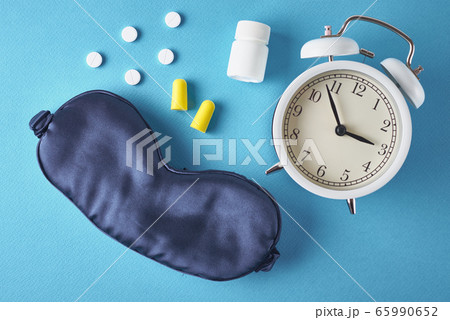 Insomnia problem concept. Alarm clock, sleeping 65990652