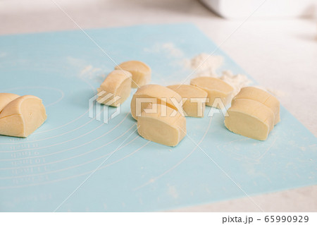 Cuted pieces of yellow healthy flour dough 65990929