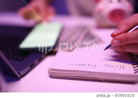 Close-up, womans hands write notepad home finances Close-up, womans hands write notepad home finances 65991610