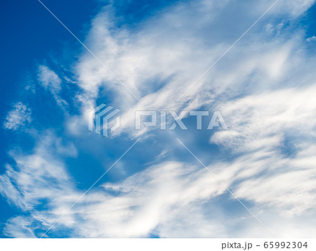 White clouds against blue sky background White clouds against blue sky background 65992304