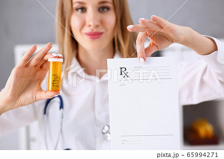 Female doctor hands hold prescription 65994271