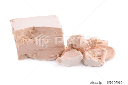 Fresh pressed yeast, isolated on white background. Fresh pressed yeast, isolated on white background. 65995994
