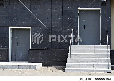 Two closed doors of service entrances in modern Two closed doors of service entrances in modern 66000468