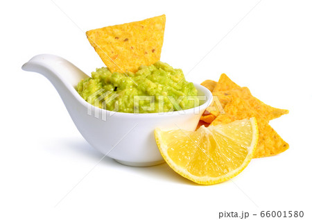 Guacamole with nachos. Isolated on white Guacamole with nachos. Isolated on white 66001580