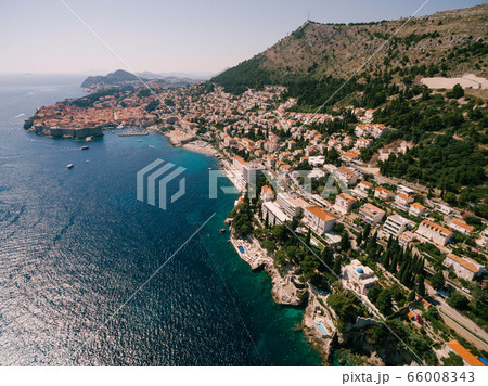 High aerial view from a drone on the coast of Dubrovnik and the old town in Croatia. High aerial view from a drone on the coast of Dubrovnik and the old town in Croatia. 66008343