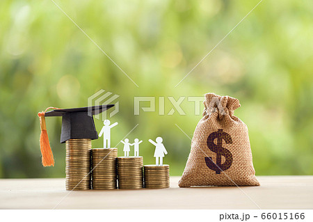 Black graduation cap, hat, student and kid, rows of rising coins, white clock on a table, natural green background. Public school funding, education funding, financial concept 66015166