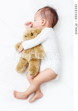 My Best Friend, Baby sleeping with her teddy bear (Soft focus and blurry) My Best Friend, Baby sleeping with her teddy bear (Soft focus and blurry) 66018382