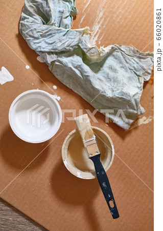 Paint brush on a can of white wall paint Paint brush on a can of white wall paint 66020861