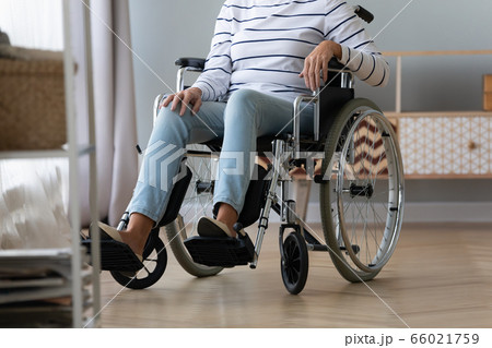 Unable to walk elderly disabled woman sitting in wheelchair Unable to walk elderly disabled woman sitting in wheelchair 66021759