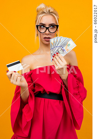 girl in a red dress with a win of money and a meditation card with a layout 66022017