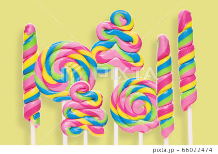 Set of colorful lollipops on yellow background. 66022474