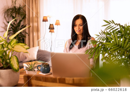 Woman is using laptop computer. Woman is using laptop computer. 66022618