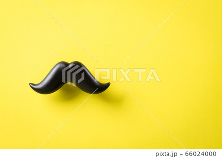 Father's day concept. Black moustache on yellow 66024000