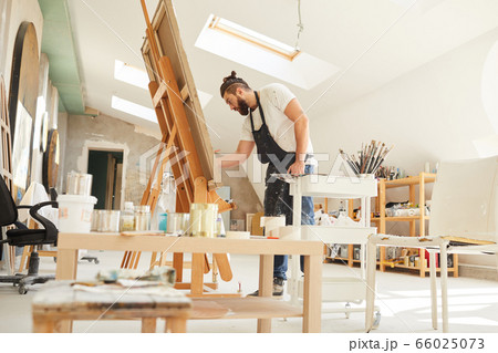Bearded Artist Painting in Art Studio Bearded Artist Painting in Art Studio 66025073